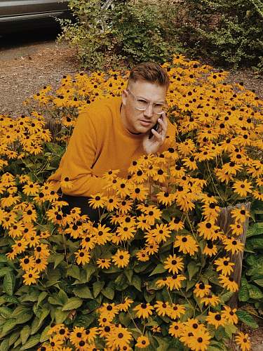 person man wearing brown sweater docking in sunflowers newberg